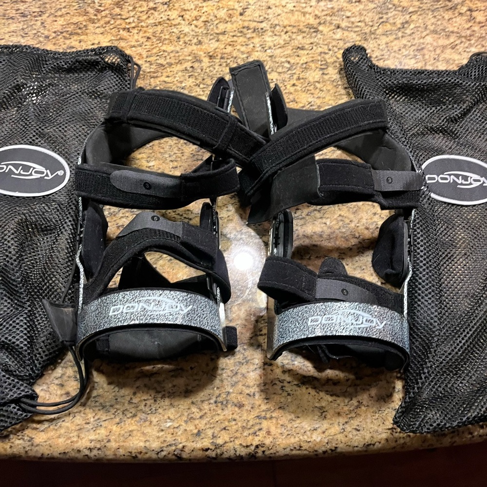 DonJoy Black and Silver Knee Braces